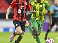 Abdelkarim Hassan (R) of Al Wakrah SC battles for the ball with Gabriel Pereira of Al Rayyan SC during the Ooredoo Qatar Stars League 24/25...