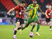 Abdelkarim Hassan (R) of Al Wakrah SC battles for the ball with Gabriel Pereira of Al Rayyan SC during the Ooredoo Qatar Stars League 24/25...