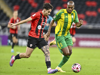 Abdelkarim Hassan (R) of Al Wakrah SC battles for the ball with Gabriel Pereira of Al Rayyan SC during the Ooredoo Qatar Stars League 24/25...