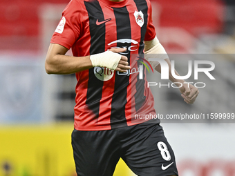 Mahmoud Hassan of Al Rayyan SC plays in the Ooredoo Qatar Stars League 24/25 match between Al Rayyan SC and Al Wakrah SC at Ahmad Bin Ali St...