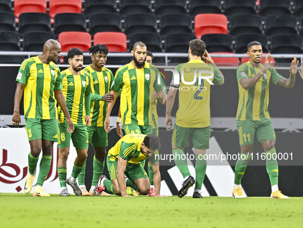 Jacinto Dala (3-L) of Al Wakrah SC celebrates after scoring a goal during the Ooredoo Qatar Stars League 24/25 match between Al Rayyan SC an...