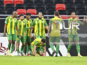 Jacinto Dala (3-L) of Al Wakrah SC celebrates after scoring a goal during the Ooredoo Qatar Stars League 24/25 match between Al Rayyan SC an...