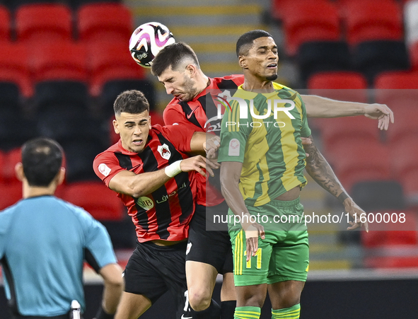 Ricardo Jorge Gomes (R) of Al Wakrah SC battles for the ball with Andre Fonseca Amaro (L) of Al Rayyan SC during the Ooredoo Qatar Stars Lea...