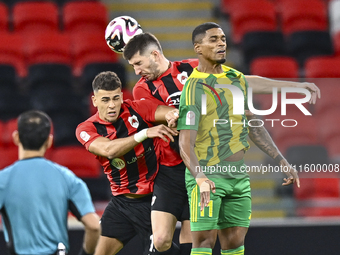 Ricardo Jorge Gomes (R) of Al Wakrah SC battles for the ball with Andre Fonseca Amaro (L) of Al Rayyan SC during the Ooredoo Qatar Stars Lea...