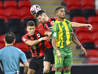 Ricardo Jorge Gomes (R) of Al Wakrah SC battles for the ball with Andre Fonseca Amaro (L) of Al Rayyan SC during the Ooredoo Qatar Stars Lea...