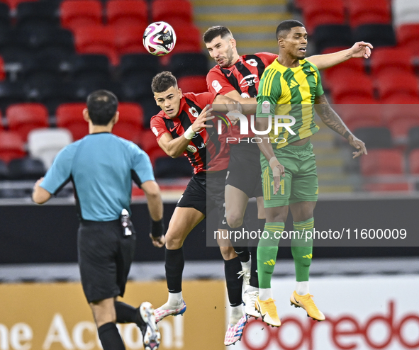 Ricardo Jorge Gomes (R) of Al Wakrah SC battles for the ball with Andre Fonseca Amaro (L) of Al Rayyan SC during the Ooredoo Qatar Stars Lea...