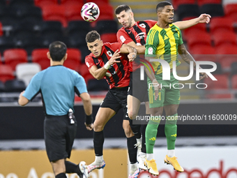 Ricardo Jorge Gomes (R) of Al Wakrah SC battles for the ball with Andre Fonseca Amaro (L) of Al Rayyan SC during the Ooredoo Qatar Stars Lea...