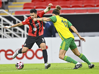 Alexander Scholz (R) of Al Wakrah SC battles for the ball with Mahmoud Hassan of Al Rayyan SC during the Ooredoo Qatar Stars League 24/25 ma...