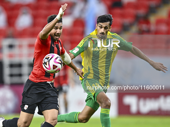 Nabil Irfan (R) of Al Wakrah SC battles for the ball with Mahmoud Hassan (L) of Al Rayyan SC during the Ooredoo Qatar Stars League 24/25 mat...