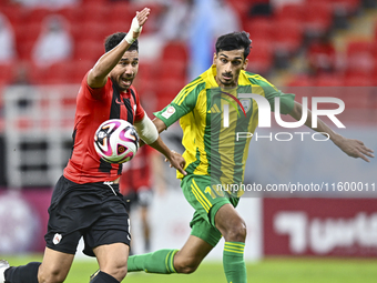 Nabil Irfan (R) of Al Wakrah SC battles for the ball with Mahmoud Hassan (L) of Al Rayyan SC during the Ooredoo Qatar Stars League 24/25 mat...