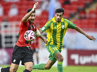 Nabil Irfan (R) of Al Wakrah SC battles for the ball with Mahmoud Hassan (L) of Al Rayyan SC during the Ooredoo Qatar Stars League 24/25 mat...