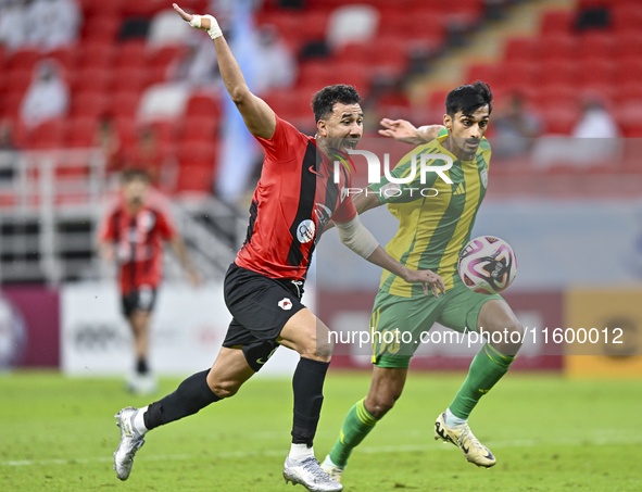 Nabil Irfan (R) of Al Wakrah SC battles for the ball with Mahmoud Hassan (L) of Al Rayyan SC during the Ooredoo Qatar Stars League 24/25 mat...