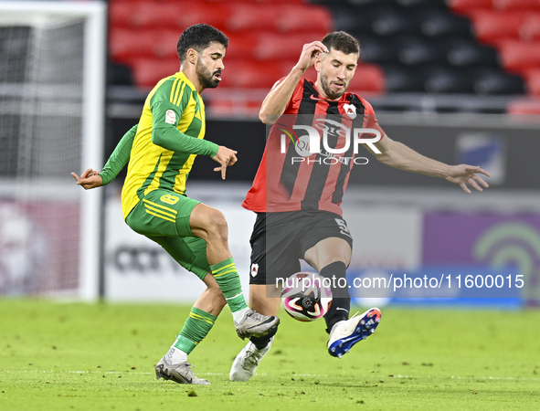 Omar Salah Alosad (L) of Al Wakrah SC battles for the ball with David Garcia (R) of Al Rayyan SC during the Ooredoo Qatar Stars League 24/25...