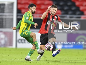 Omar Salah Alosad (L) of Al Wakrah SC battles for the ball with David Garcia (R) of Al Rayyan SC during the Ooredoo Qatar Stars League 24/25...