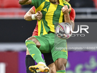 Ricardo Jorge Gomes (R) of Al Wakrah SC battles for the ball with Andre Fonseca Amaro of Al Rayyan SC during the Ooredoo Qatar Stars League...