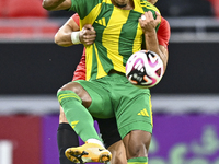 Ricardo Jorge Gomes (R) of Al Wakrah SC battles for the ball with Andre Fonseca Amaro of Al Rayyan SC during the Ooredoo Qatar Stars League...