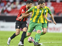 Lucas Mendes (R) of Al Wakrah SC battles for the ball with Mahmoud Hassan of Al Rayyan SC during the Ooredoo Qatar Stars League 24/25 match...