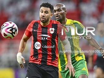 Abdelkarim Hassan of Al Wakrah SC battles for the ball with Mahmoud Hassan of Al Rayyan SC during the Ooredoo Qatar Stars League 24/25 match...