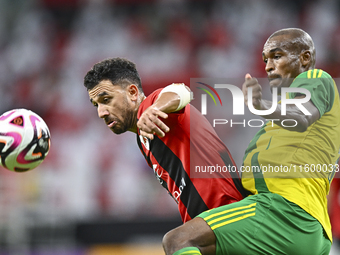 Abdelkarim Hassan (R) of Al Wakrah SC battles for the ball with Mahmoud Hassan of Al Rayyan SC during the Ooredoo Qatar Stars League 24/25 m...