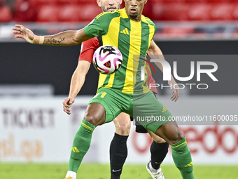 Ricardo Jorge Gomes of Al Wakrah SC battles for the ball with David Garcia of Al Rayyan SC during the Ooredoo Qatar Stars League 24/25 match...