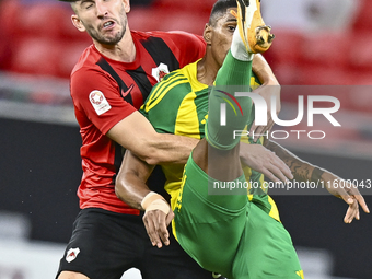 Ricardo Jorge Gomes of Al Wakrah SC battles for the ball with David Garcia of Al Rayyan SC during the Ooredoo Qatar Stars League 24/25 match...