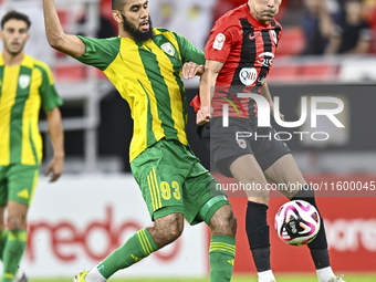 Aissa Belal Laidouni of Al Wakrah SC battles for the ball with Achraf Bencharki of Al Rayyan SC during the Ooredoo Qatar Stars League 24/25...