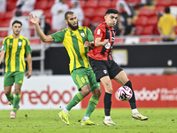 Aissa Belal Laidouni of Al Wakrah SC battles for the ball with Achraf Bencharki of Al Rayyan SC during the Ooredoo Qatar Stars League 24/25...