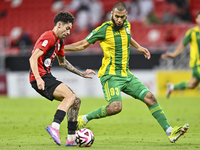 Aissa Belal Laidouni of Al Wakrah SC battles for the ball with Andre Fonseca Amaro of Al Rayyan SC during the Ooredoo Qatar Stars League 24/...