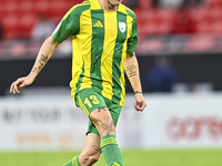 Alexander Scholz (#13) of Al Wakrah SC plays in the Ooredoo Qatar Stars League 24/25 match between Al Rayyan SC and Al Wakrah SC at Ahmad Bi...