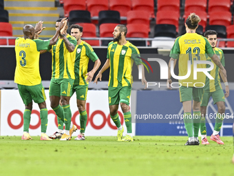 Ricardo Jorge Gomes (2-L) of Al Wakrah SC celebrates after scoring a goal during the Ooredoo Qatar Stars League 24/25 match between Al Rayya...