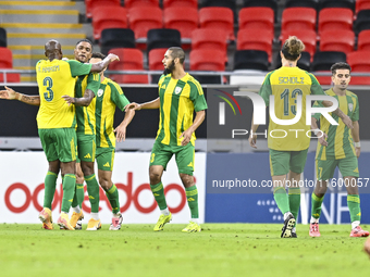 Ricardo Jorge Gomes (2-L) of Al Wakrah SC celebrates after scoring a goal during the Ooredoo Qatar Stars League 24/25 match between Al Rayya...