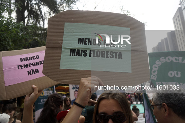 Protestors march for climate justice and against wildfires affecting the entire country in Sao Paulo, Brazil, on September 22, 2024. 