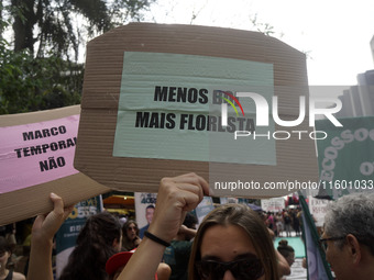 Protestors march for climate justice and against wildfires affecting the entire country in Sao Paulo, Brazil, on September 22, 2024. (