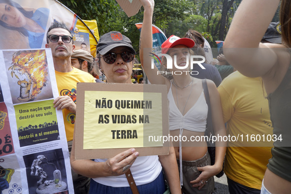 Protestors march for climate justice and against wildfires affecting the entire country in Sao Paulo, Brazil, on September 22, 2024. 