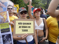 Protestors march for climate justice and against wildfires affecting the entire country in Sao Paulo, Brazil, on September 22, 2024. (