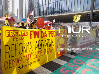 Protestors march for climate justice and against wildfires affecting the entire country in Sao Paulo, Brazil, on September 22, 2024. (