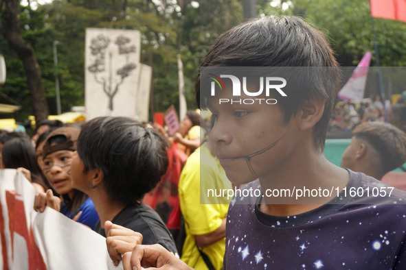 Protestors march for climate justice and against wildfires affecting the entire country in Sao Paulo, Brazil, on September 22, 2024. 