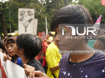 Protestors march for climate justice and against wildfires affecting the entire country in Sao Paulo, Brazil, on September 22, 2024. (