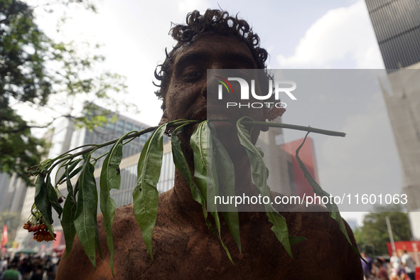 Protestors march for climate justice and against wildfires affecting the entire country in Sao Paulo, Brazil, on September 22, 2024. 