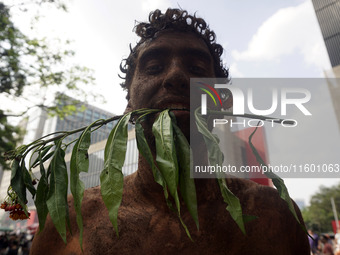 Protestors march for climate justice and against wildfires affecting the entire country in Sao Paulo, Brazil, on September 22, 2024. (