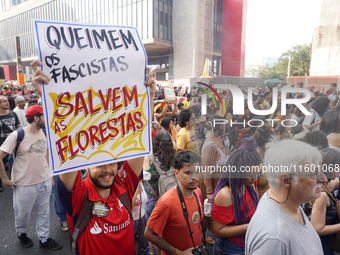 Protestors march for climate justice and against wildfires affecting the entire country in Sao Paulo, Brazil, on September 22, 2024. (