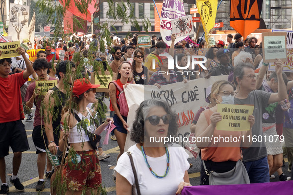 Protestors march for climate justice and against wildfires affecting the entire country in Sao Paulo, Brazil, on September 22, 2024. 