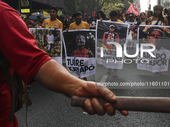 Protesters hold a demonstration against the fires and the climate situation in Brazil and for agrarian reform on Avenida Paulista, in the ce...