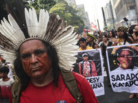 Protesters hold a demonstration against the fires and the climate situation in Brazil and for agrarian reform on Avenida Paulista, in the ce...