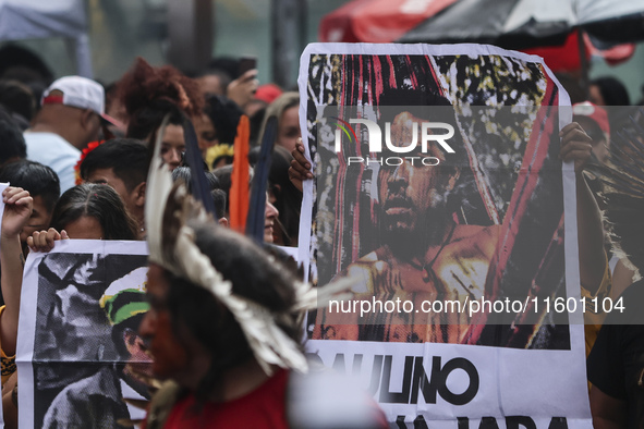 Protesters hold a demonstration against the fires and the climate situation in Brazil and for agrarian reform on Avenida Paulista, in the ce...