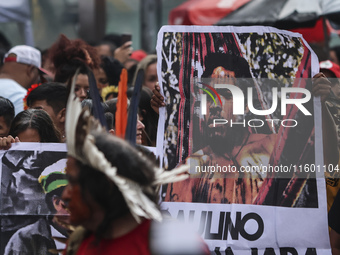 Protesters hold a demonstration against the fires and the climate situation in Brazil and for agrarian reform on Avenida Paulista, in the ce...