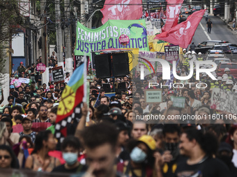 Protesters hold a demonstration against the fires and the climate situation in Brazil and for agrarian reform on Avenida Paulista, in the ce...