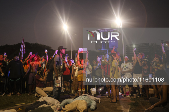 Protesters hold a demonstration against the fires and the climate situation in Brazil and for agrarian reform on Avenida Paulista, in the ce...