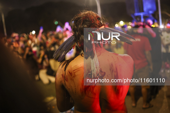 Protesters hold a demonstration against the fires and the climate situation in Brazil and for agrarian reform on Avenida Paulista, in the ce...