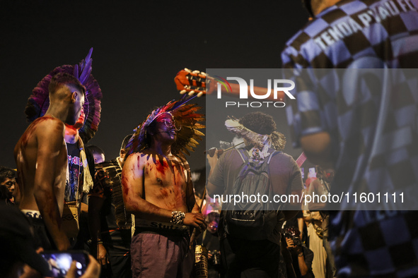 Protesters hold a demonstration against the fires and the climate situation in Brazil and for agrarian reform on Avenida Paulista, in the ce...